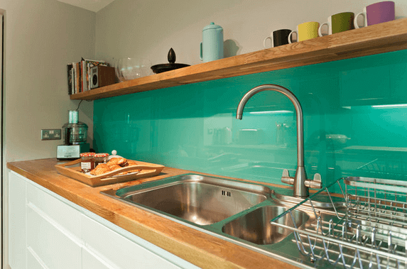 9.-Glossy-Color-Glass-Kitchen-Backsplash-thespruce.com_